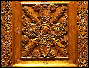This is a small part of the detailed carvings in the bronze doors of the Plummer Building - taken at night.
